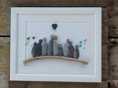 a group of rocks sitting on top of a white frame