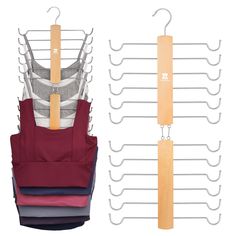 four pairs of aprons hanging on clothes racks with wooden hangers attached to them