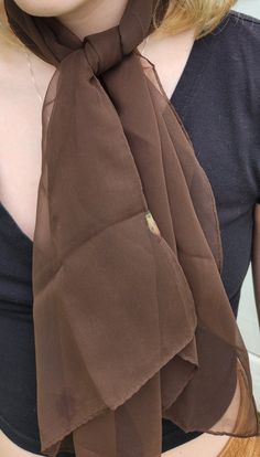 This is a lovely, vintage, chocolate brown scarf! This beautiful, sheer scarf is in good condition and measures 15" x 43 1/2". This long scarf is made of a nylon chiffon and has stood the test of time. Perfect for accessorizing or for a vintage clothing collection! Brown Scarf, Vintage Chocolate, Brown Scarves, Sheer Scarf, Long Scarf, Chocolate Brown, Vintage Clothing, New Day, Scarf Wrap