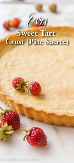 two strawberries on top of a pie crust with the words easy sweet tart crust plate sure