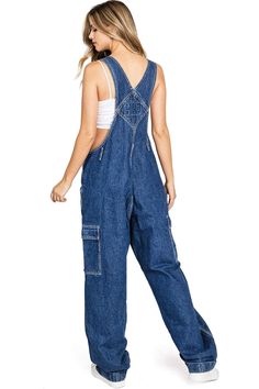 Classic twill canvas overalls with baggy?straight leg?fit, cargo pockets and a cuffed hem. Traditional style bib with pockets on the chest?and to the sides and button up closures on the sides. Try it paired with a crop top or layer a long sleeve tee underneath! CARE | Hand Wash or Machine Wash Cold CONTENTS | 100% Cotton?MEASUREMENTS | 56"/142 cm Top to Bottom 29"/74 cm Inseam (Size Small) MODEL | 5'8 - wearing a size SmallIMPORTED Cheap Denim Bib Front Bottoms, Plus Size Overalls, Minion Outfit, Workwear Jumpsuit, Vintage Cargo Pants, Pants Overalls, Vintage Overalls, Plus Size Vintage, Bib Overalls