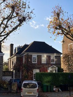 a car is parked in front of a house