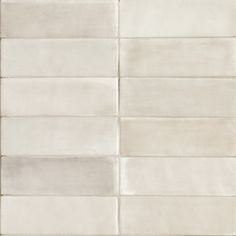 a white tile wall that is very clean