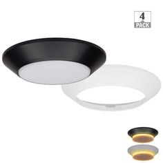 two lights that are next to each other on a white surface with black and gold trims