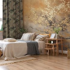 a bedroom with wood flooring and large wall mural behind the bed, along with two small side tables