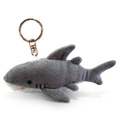 a stuffed shark keychain is shown on a white background