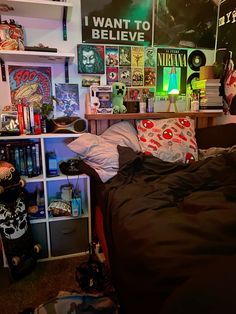 a bedroom with lots of books and posters on the wall