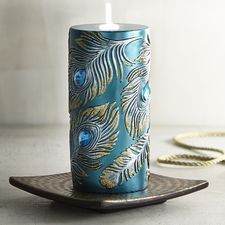 a blue candle sitting on top of a plate