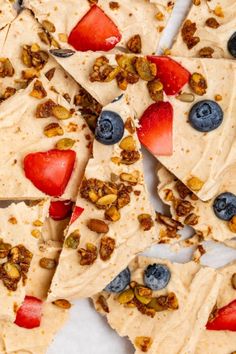 sliced fruit and nut brittles are arranged on top of each other