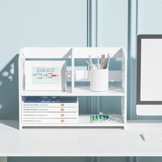 a desktop computer sitting on top of a white desk