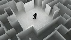 a man standing in the middle of a maze