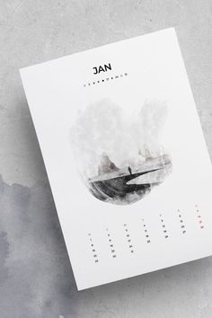 a calendar sitting on top of a table next to a gray wall with the word wac written in it