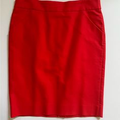 The Pencil Skirt. J Crew. Size 10. 100% Cotton. Dry Clean. Never Worn Red Knee-length Skirt With Pockets, Office Red Pencil Skirt, Red Lined Pencil Skirt, Red Pencil Skirt For Office, Red Fitted Skirt For Workwear, Red Pencil Skirt For Summer, Red Knee-length Pencil Skirt For Spring, Relaxed Fit Red Lined Pencil Skirt, Red Lined Pencil Skirt For Office