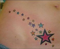 a woman's back with colorful stars on it