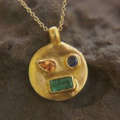 solid 24k gold pendant//gold emerald sapphire necklace//artisan gold handmade//24k gold pendant//24k gold pendant//emerald pendant//24k gold I'm so happy with this one and the few more I have to add to this new collection. The stones are amazing emeralds and sapphires. This pendant will elevate your style for sure. 24k gold emerald and sapphires pendant size of pendant 15.5mm / 0.6"  diameter approximately , (with the bale 20X15.5) emerald is a 7x3.5 mm. 1.1ct blue sapphire 3.5mm. orange sapphir Gold Stone Necklace, Solid Gold Necklace, Emerald Pendant, Orange Sapphire, Sapphire Pendant, Gold Stone, Sapphire Necklace, Pendant Gold, Recycled Gold