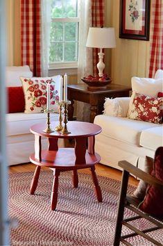 a living room with two couches and a coffee table in the middle of it