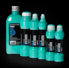 six bottles of blue liquid on a black background