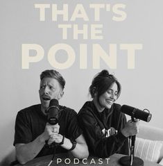 a man and woman sitting on top of a couch next to each other holding microphones