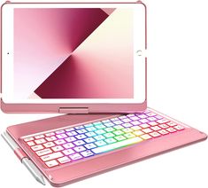 a pink laptop with a keyboard on it