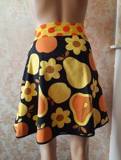 "Vintage A line skirt,  black back ground with yellow, orange and brown flowers and fruit.   Waist; 38\" Hip;  48\" Length;   19\"     Made by SOMETHING ELSE" 60s Skirt, Vintage Halter Dress, Flowers And Fruit, Boho Coat, Purple Quilts, Retro Skirt, Brown Flowers, Yellow Skirt, Floral Mini Skirt