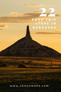 a mountain with the words 22 road trip stops in nebraska