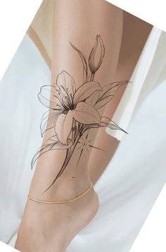 a woman's leg with flowers drawn on it