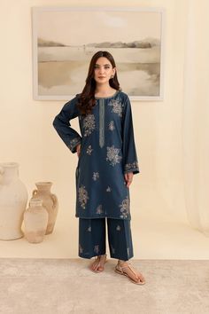 Batik Embroidered Lawn Dress Adira 2Pc Embrace tradition with our Pakistani outfits online. This ready-to-wear 2Pc dress in premium Pima lawn features a straight fit shirt with an embroidered neckline and composed motifs. The loose fit sleeves are adorned with embroidered borders and lace. Paired with embroidered cambric culottes, it captures the essence of celebration. Premium Pima lawn Embroidered neckline Straight fit shirt Embroidered cambric culottes Note: Colors may slightly vary due to li Blue Long Sleeve Palazzo Set With Floral Embroidery, Traditional Indigo Sets With Resham Embroidery, Blue Palazzo Set With Intricate Embroidery And Long Sleeves, Blue Palazzo Set With Intricate Embroidery, Blue Long Sleeve Palazzo Set With Intricate Embroidery, Eid Indigo Sets With Resham Embroidery, Indigo Embroidered Sets For Diwali, Indigo Sets With Resham Embroidery For Eid, Indigo Traditional Wear For Eid