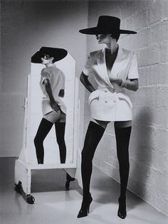 an instagram photo of two women in black and white outfits, one wearing a hat