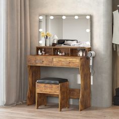 a dressing table with a mirror and stool