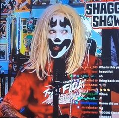 a man with makeup on his face is standing in front of a tv screen that has the words shaggy show written on it