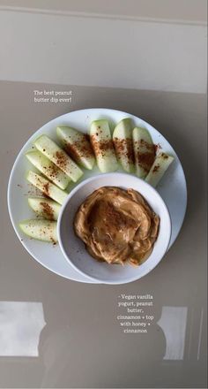 a plate with apples and peanut butter on it