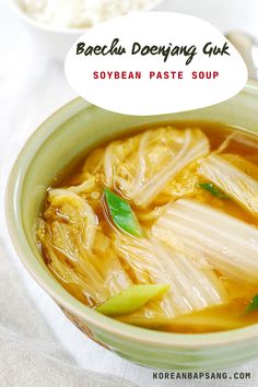 a bowl filled with soup on top of a table