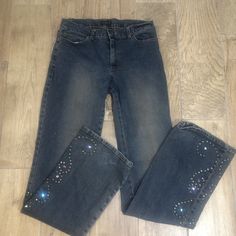 Dark wash with faded out spots (brownish tones) in the middle. Y2K chic boho flared leg/boot cut denim jeans with embellishments on the legs. Very cute! Excellent condition. No holes or stains. Size 6. 28X32 Bedazzled Flare Jeans, Flared Jeans Rhinestone, Bejeweled Jeans, Badazzled Flare Jeans, Bejeweled Jeans Y2k, Y2k Flare Denim Jeans, Rhinestone Clothes, Y2k Chic, 2000s Jeans