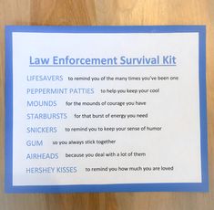 a law enforcement survival kit sitting on top of a wooden table