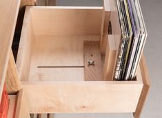 an open drawer with several records in it