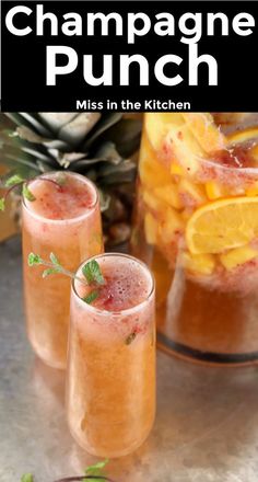 two glasses filled with champagne punch on top of a table