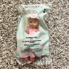 a doll in a plastic bag on the floor