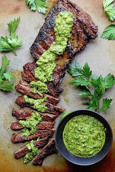 grilled steak with guacamole sauce and parsley