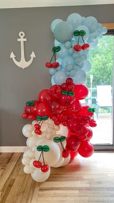 balloons are arranged in the shape of animals and cherries