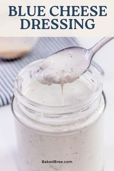 a spoon full of blue cheese dressing on top of a white tablecloth with text overlay