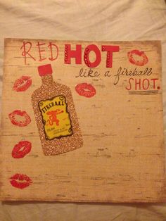 a red hot sauce sign with lipstick on it