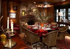 the dining room is decorated with plaid tablecloths and christmas decorations, along with candles