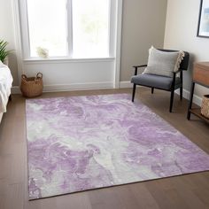 a living room with a purple rug on the floor next to a chair and window