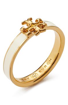 The brand's iconic logo adds a burnished glow to this enameled band that's a perfect fit for your eye-catching stack. Goldtone plate/enamel Imported Tory Burch Ring, Xoxo Jewelry, Preppy Accessories, Tory Burch Kira, Dope Jewelry, Jewelry Fashion Trends