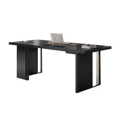 an office desk with a laptop on it