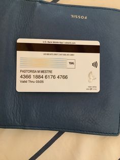 a credit card sitting on top of a blue case