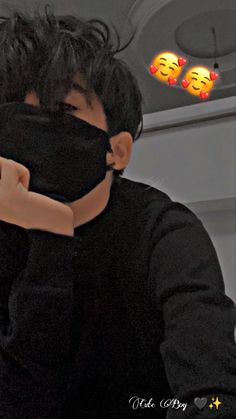 a man wearing a black mask covering his face