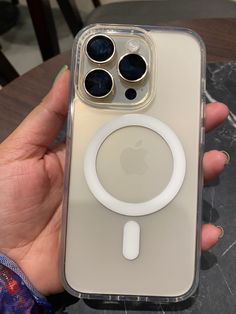 a person holding an iphone case with a magnifying glass on the front and back