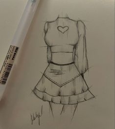 a drawing of a woman's dress with a heart drawn on the front and back