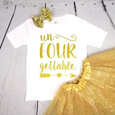 a t - shirt that says un four gettable with a gold tutu